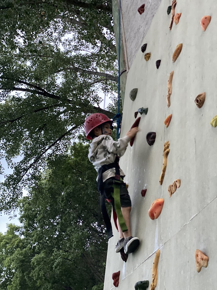 A child climbing the rock wall